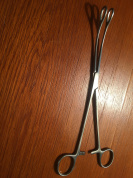 FOERSTER swab forceps serrated Cvd. 25cm.